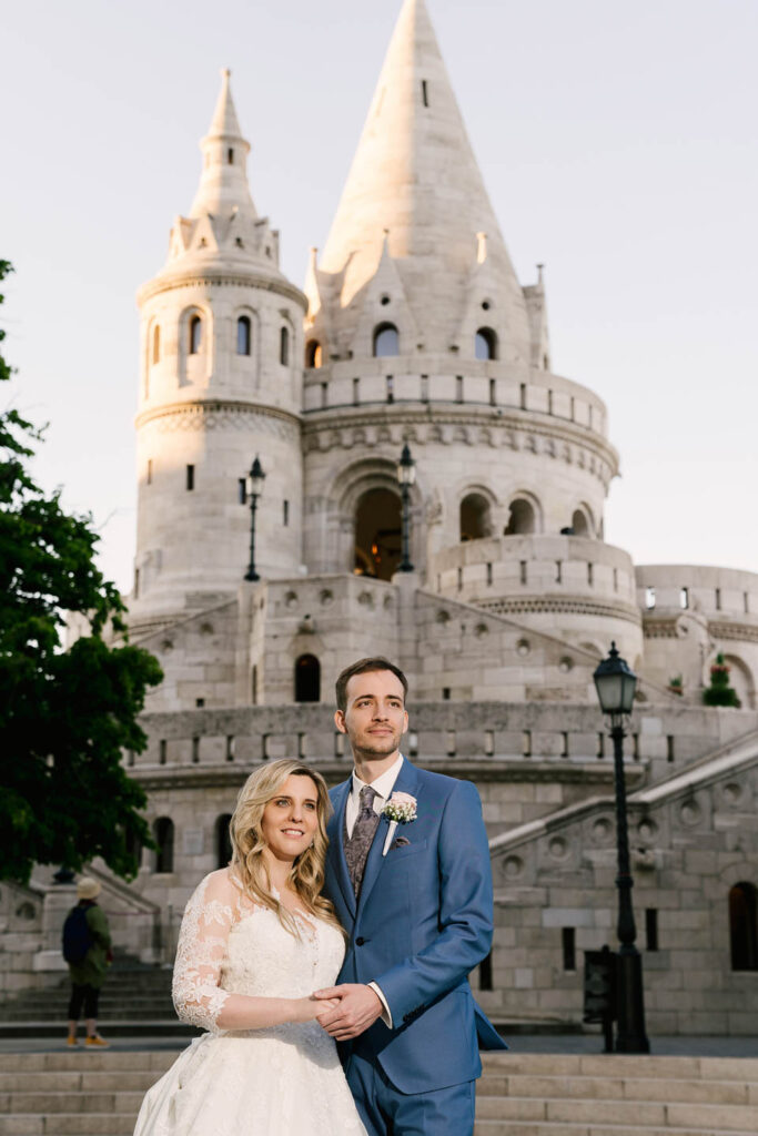 Wedding Couple sanding for the castle. Professional wedding phtographer Vienna